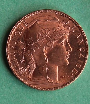a close up of a coin with a woman ' s face on it