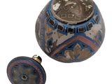 an image of a decorative vase and a knob