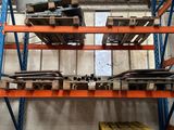 many pallets and boxes in the warehouse on the shelves