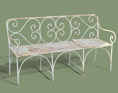 a white bench with a metal frame on a green background