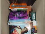 a box full of books that are sitting on the floor