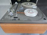 a record player that is sitting on top of a table