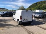 a white van that is parked in a parking lot