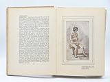 an open book with a drawing of a woman sitting on a chair