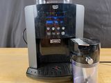 a coffee maker that is sitting on a wooden table
