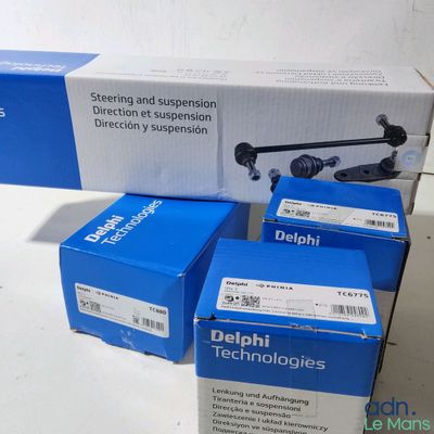 three boxes of delphi technologies sit next to each other on a table