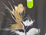 a t - shirt with a picture of a cat on it