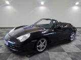 an image of a black sports car parked in a garage