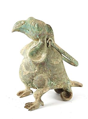 figurine en bronze représentant un oiseau au long bec et à la longue queue
