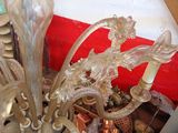 a glass chandelier that is sitting on a table