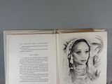an open book with a drawing of a woman in a headdress