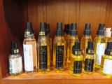 many bottles of different types of oils on a shelf