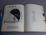 an open book with a picture of a cat inside of it