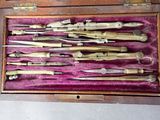 many different types of tools in a wooden case