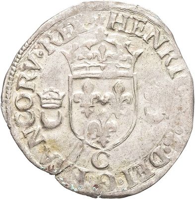 an old silver coin with a crown on top of it