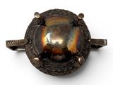 a close up of a ring with a stone in it