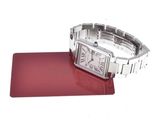 an image of a wrist watch sitting on top of a red mat
