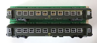 three model trains sitting on top of each other on a table