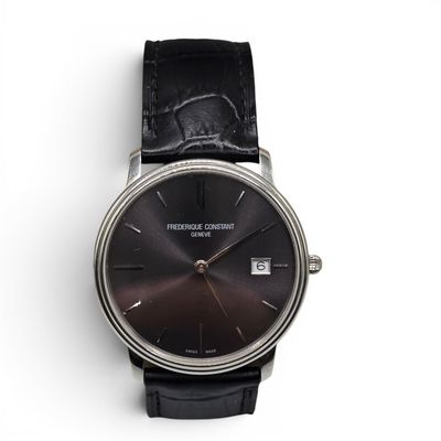 an image of a close up of a wrist watch on a white surface