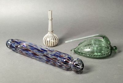 three glass objects on the table next to each other