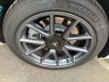 a close up of a tire on a car ' s rim