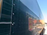 a semi truck that is parked in a garage
