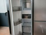an image of a stainless steel refrigerator with its door open