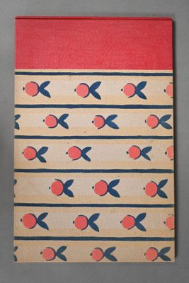 a close up of a notebook with an orange and blue pattern on it