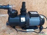 a pump that is sitting on top of a wooden floor