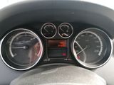 a close up of a car dashboard with various gauges