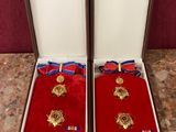 two medals are in a box on a table