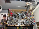 a wooden box filled with assorted items in a room