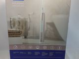 packaging for a new toothbrush in a box on a white surface