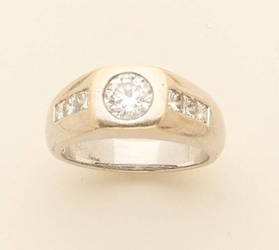 a close up of a diamond ring on a white background
