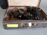 an old suitcase with a lot of different types of tools in it