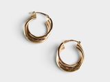 a pair of gold hoop earrings on a white background