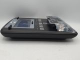 a black electronic device that is sitting on a table