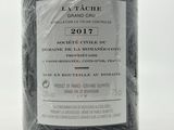 a bottle of wine that is wrapped in plastic