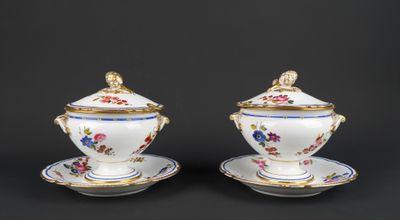 pair of porcelain sugar and creamers with floral decoration