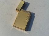 a lighter that is sitting on a white surface