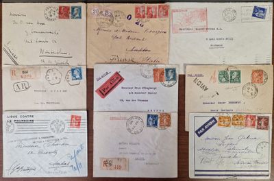 many different types of letters and envelopes on the table