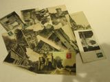 a pile of old postcards sitting on a table