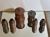 a lot of brown vases sitting on a glass table