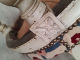 a close up of a pair of shoes that are on a table