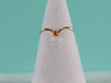 a close up of a white cone with a gold ring on top of it