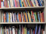 a bookshelf full of books in a library