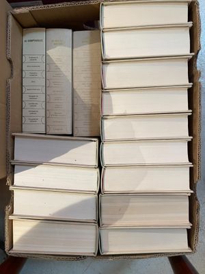 a box full of books sitting on the ground