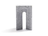 a small stone table that has a small arch on top of it