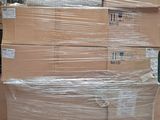 a large stack of boxes sitting on a pallet in a warehouse