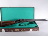 a gun in a case on a white surface